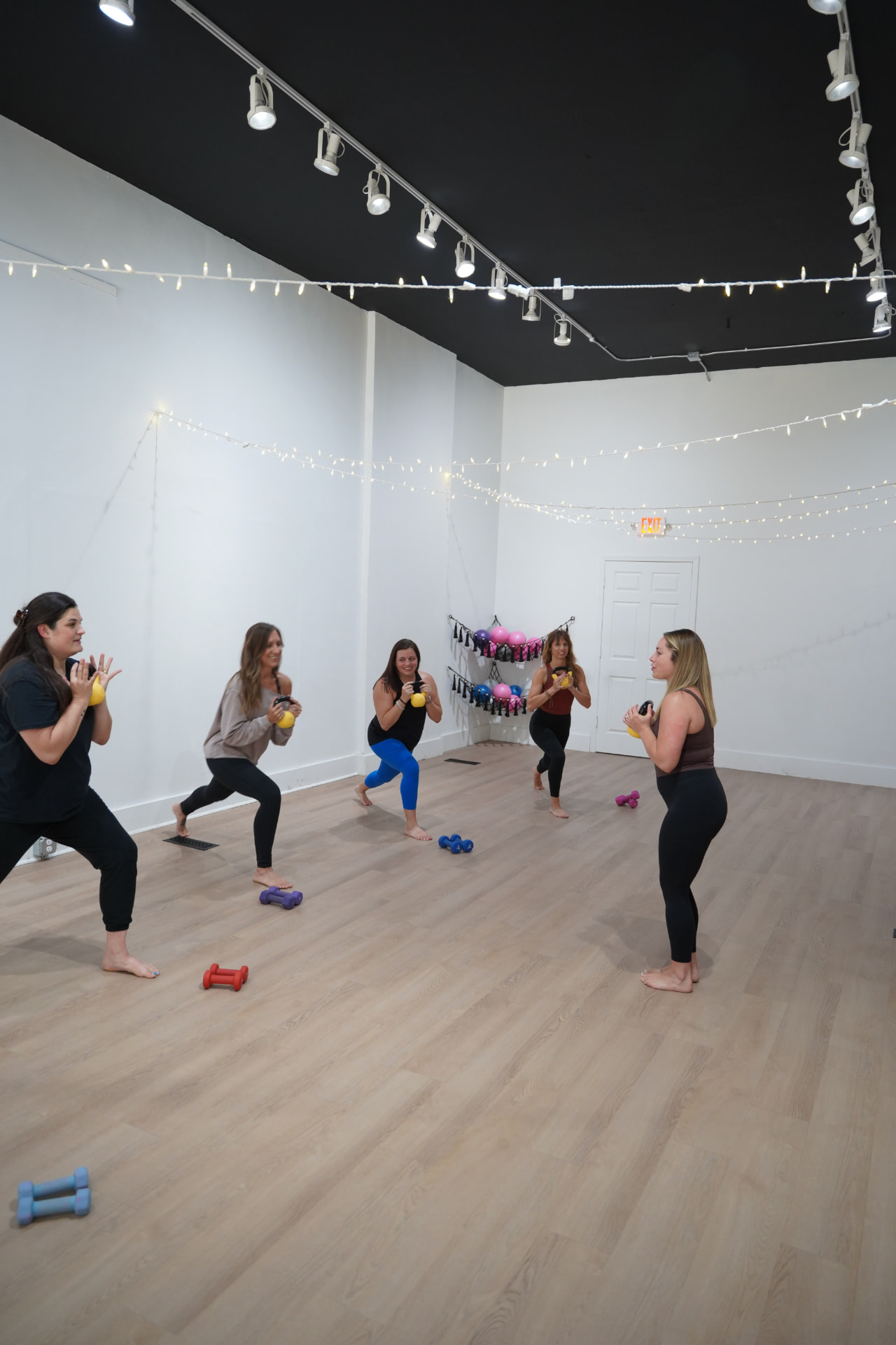 Members standing in a circle holding kettlebells during a strength class in Bellefontaine
